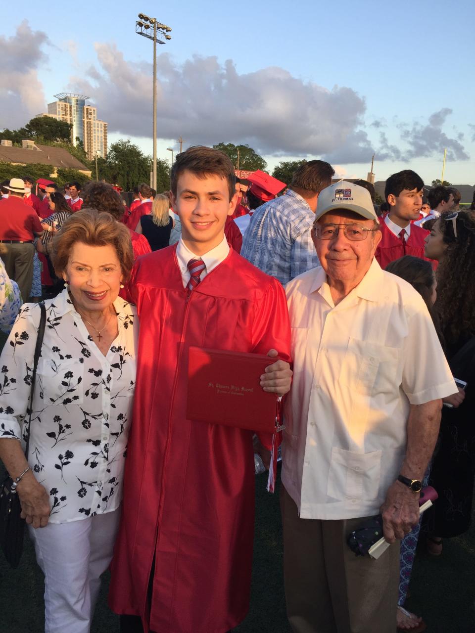 Chris Schlak, graduating from St. Thomas High School in Houston in 2018, with grandparents  Nereida and Tomás Rodriguez.