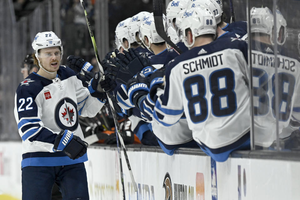 Winnipeg Jets center Mason Appleton, left, celebrates with teammates after scoring against the Anaheim Ducks during the first period of an NHL hockey game in Anaheim, Calif., Thursday, March 23, 2023. (AP Photo/Alex Gallardo)