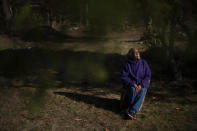 Hazel Harding Currence, 78, a Herring Pond Wampanoag Tribe Elder, sits for a portrait in her backyard in Bourne, Mass., Tuesday, Oct. 6, 2020. "We were exposed to disease. We were exposed to slavery. I mean, what happened here was people who came not just for religion, that might have been their purpose of leaving their homeland, but they came here and wanted to wipe out the existence of a whole culture," said Currence. "We should have never been treated the way that we were, our ancestors," Currence added. "I think that if they were here now, if they were looking down on us, I think they'd be very proud at the movement that's going forward now." (AP Photo/David Goldman)