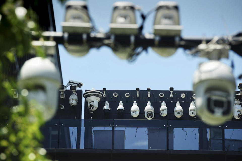 This picture shows Dahua surveillance cameras being installed on the Dahua Technologies office building in Hangzhou, in east China's Zhejiang province on May 29, 2019. (Photo by STR / AFP) / China OUT (Photo by STR/AFP via Getty Images)