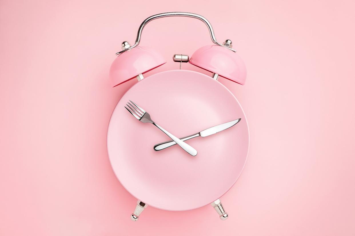 a clock with silverware