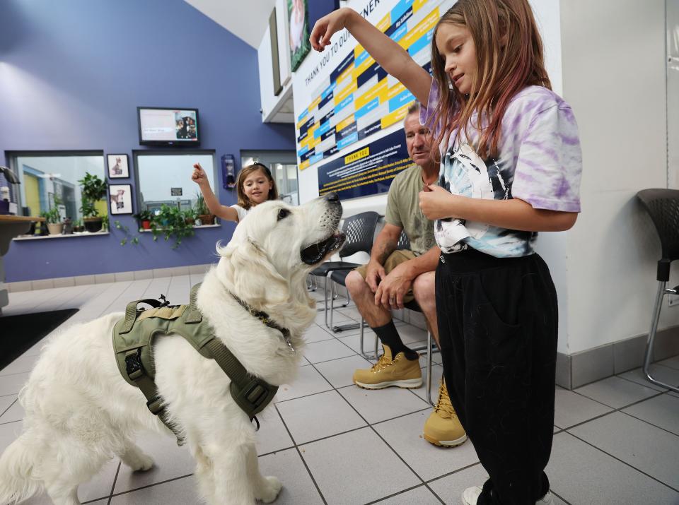 Savannah Wells and Lexie Sides play with their dog at Salt Lake County Animal Services in Salt Lake City on Thursday, June 8, 2023. Best Friends Animal Society reports that Utah has 13 kill shelters. Salt Lake County Animal Services is not a kill shelter. | Jeffrey D. Allred, Deseret News