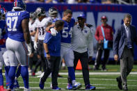 New York Giants inside linebacker Blake Martinez (54) is walked off the field after an apparent injury during the first half of an NFL football game against the Atlanta Falcons, Sunday, Sept. 26, 2021, in East Rutherford, N.J. (AP Photo/Seth Wenig)