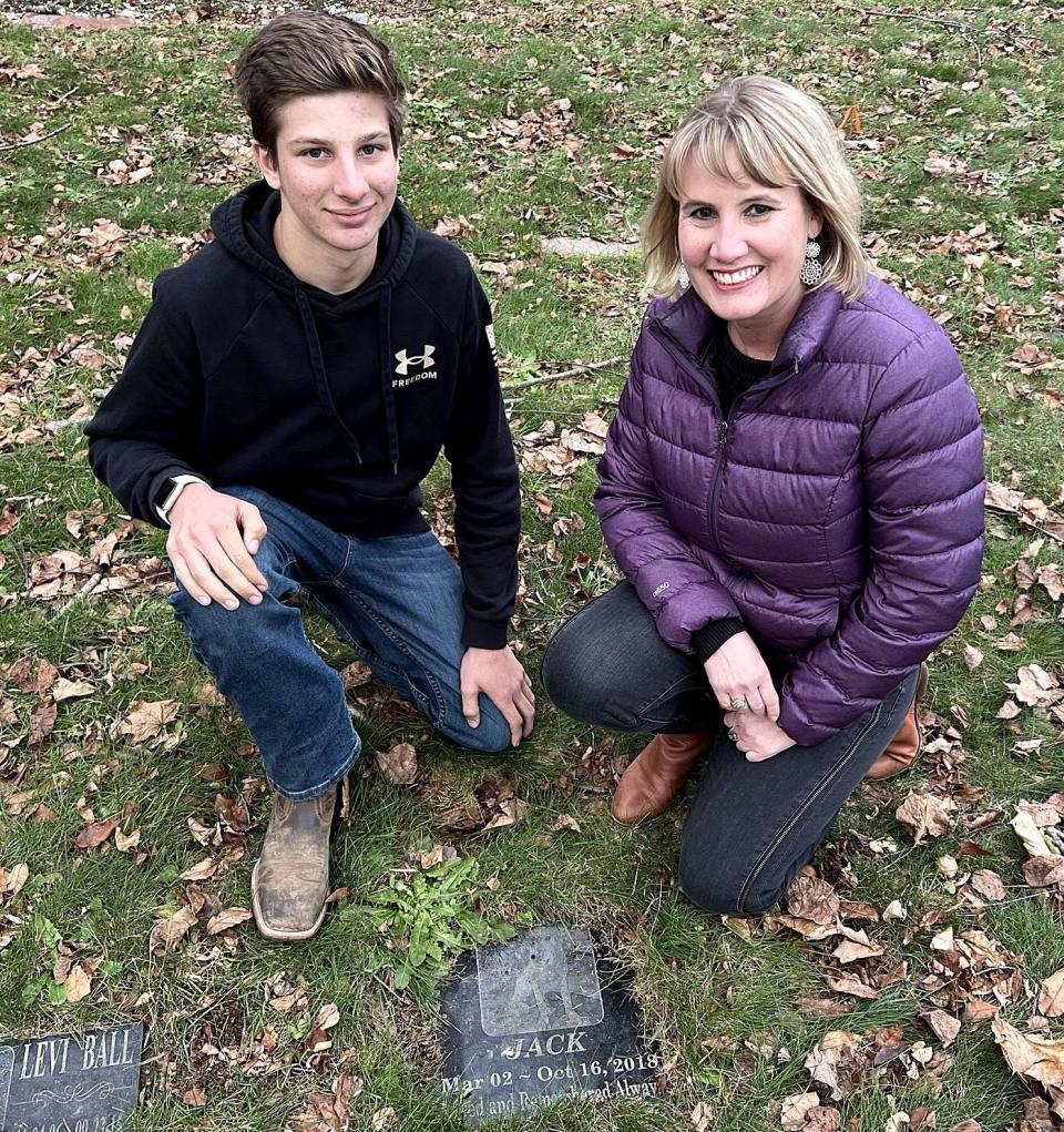 James and Jennifer Farrar, co-owners of Hearthside Pet Cemetery, 6330 Rick Road in McKean Township, are shown next to the marker of their golden retriever, Jack, on Dec. 5, 2022.