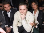 Also at the Dior show on Friday: Brooklyn Beckham, with parents David and Victoria.