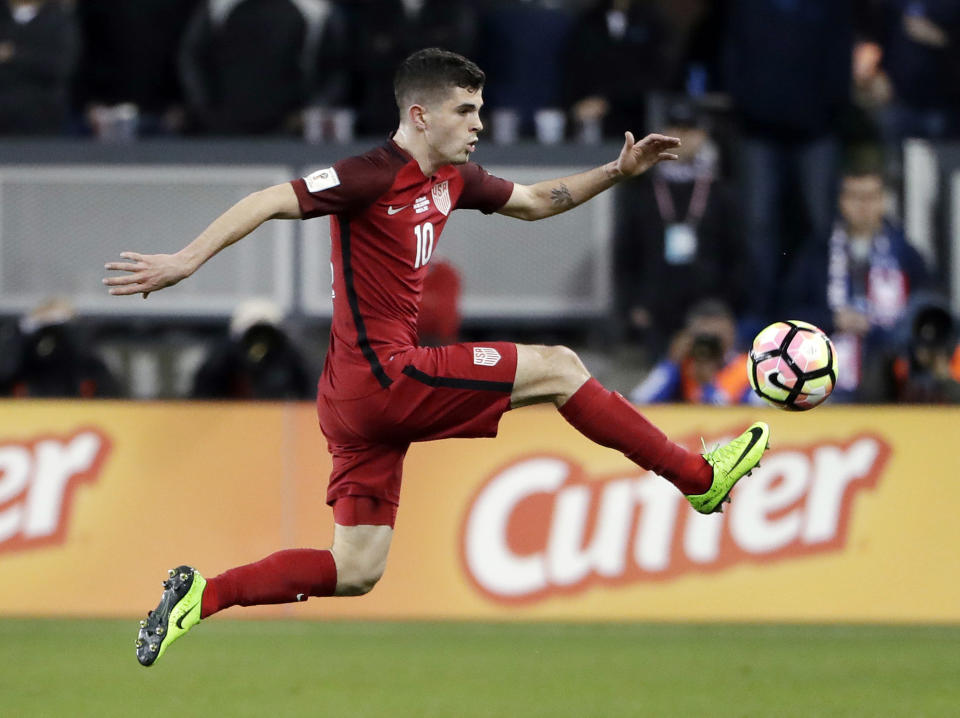 FILE - In this Friday, March 24, 2017, file photo, United States&#39; Christian Pulisic, right, controls the ball during the first half of a World Cup qualifying soccer match against Honduras in San Jose, Calif. Pulisic is one of a number of young American players that have participated in the Generation Adidas Cup. The youth development tournament operated by Major League Soccer will hold its 10th tournament beginning this weekend outside Dallas with a record 13 international academy teams participating.(AP Photo/Marcio Jose Sanchez, File)