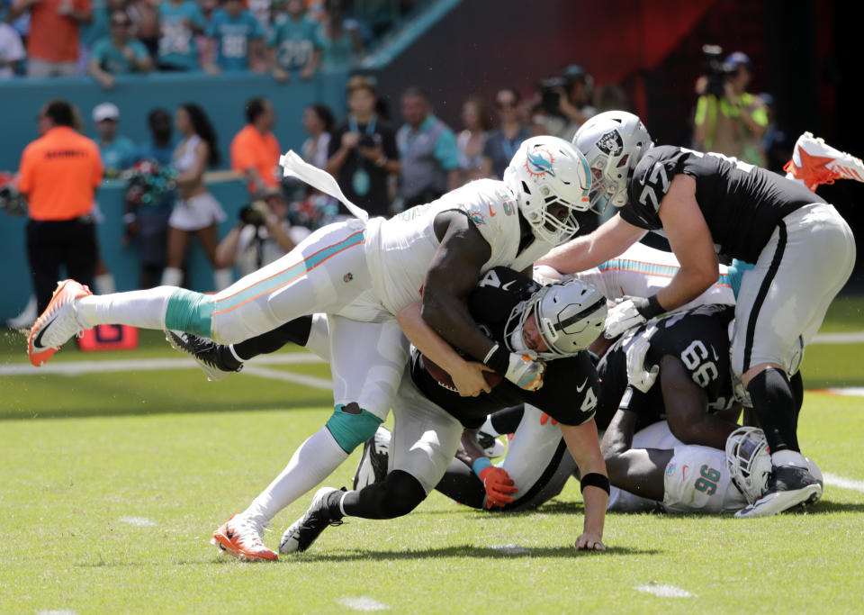 Miami Dolphins defensive end William Hayes is out for the rest of the season after tearing his right ACL on this play. (AP)