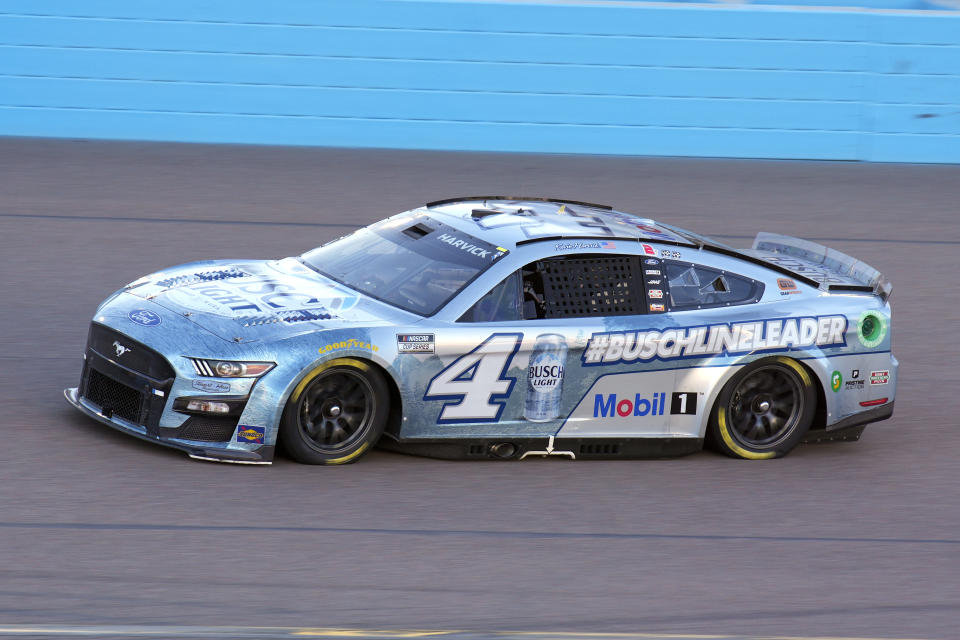 FILE - Kevin Harvick (4) drives during the NASCAR Cup Series auto race Sunday, Nov. 6, 2022, in Avondale, Ariz. Harvick is looking for the exit ramp as he enters his final season as a NASCAR driver, at the same time seven-time champion Jimmie Johnson is sliding back into stock cars. This 75th season of NASCAR begins Sunday, Feb. 19, 2023, with the Daytona 500 and is a year of both celebration and transition. (AP Photo/Rick Scuteri, File)