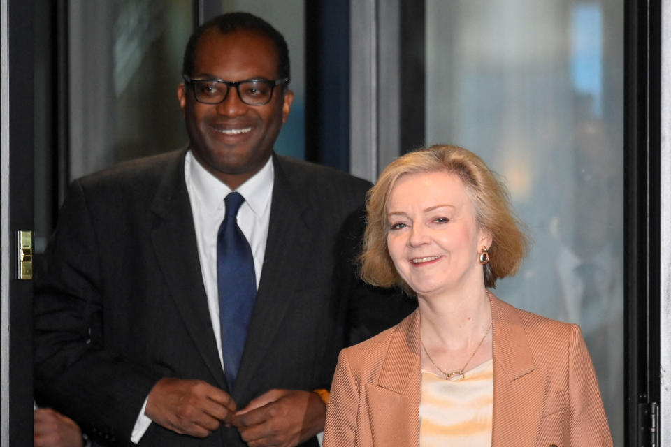 mini budget British Prime Minister Liz Truss and Chancellor of the Exchequer Kwasi Kwarteng walk outside a hotel, as Britain's Conservative Party's annual conference continues, in Birmingham, Britain, October 4, 2022. REUTERS/Toby Melville