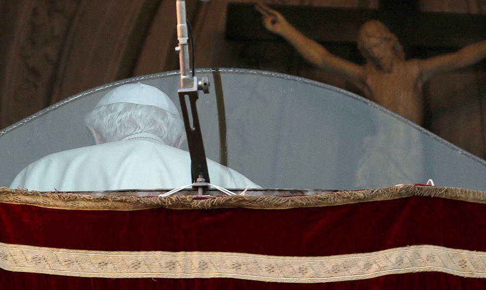 FILE - Pope Benedict XVI walks away after addressing the crowd from a window of his summer residence Castel Gandolfo, Italy, on Feb. 28, 2013. He was the reluctant pope, a shy bookworm who preferred solitary walks in the Alps and Mozart piano concertos to the public glare and majesty of Vatican pageantry. When Cardinal Joseph Ratzinger became Pope Benedict XVI and was thrust into the footsteps of his beloved and charismatic predecessor, he said he felt a guillotine had come down on him. The Vatican announced Saturday Dec. 31, 2022 that Benedict, the former Joseph Ratzinger, had died at age 95. (AP Photo/Andrew Medichini, File)