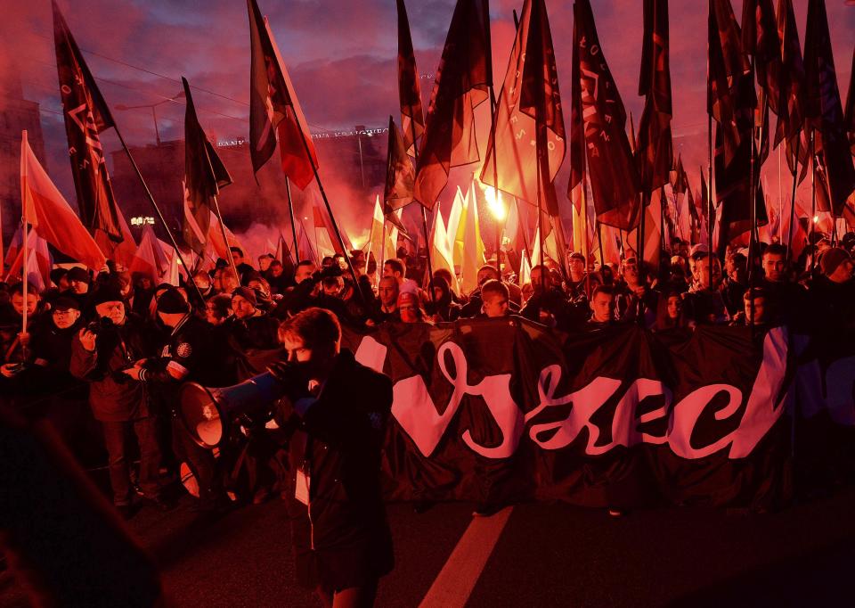 People take part in the March of Independence organized by far right activists to celebrate 101 years of Poland's independence, in Warsaw, Poland, Monday, Nov. 11, 2019. (AP Photo/Czarek Sokolowski)