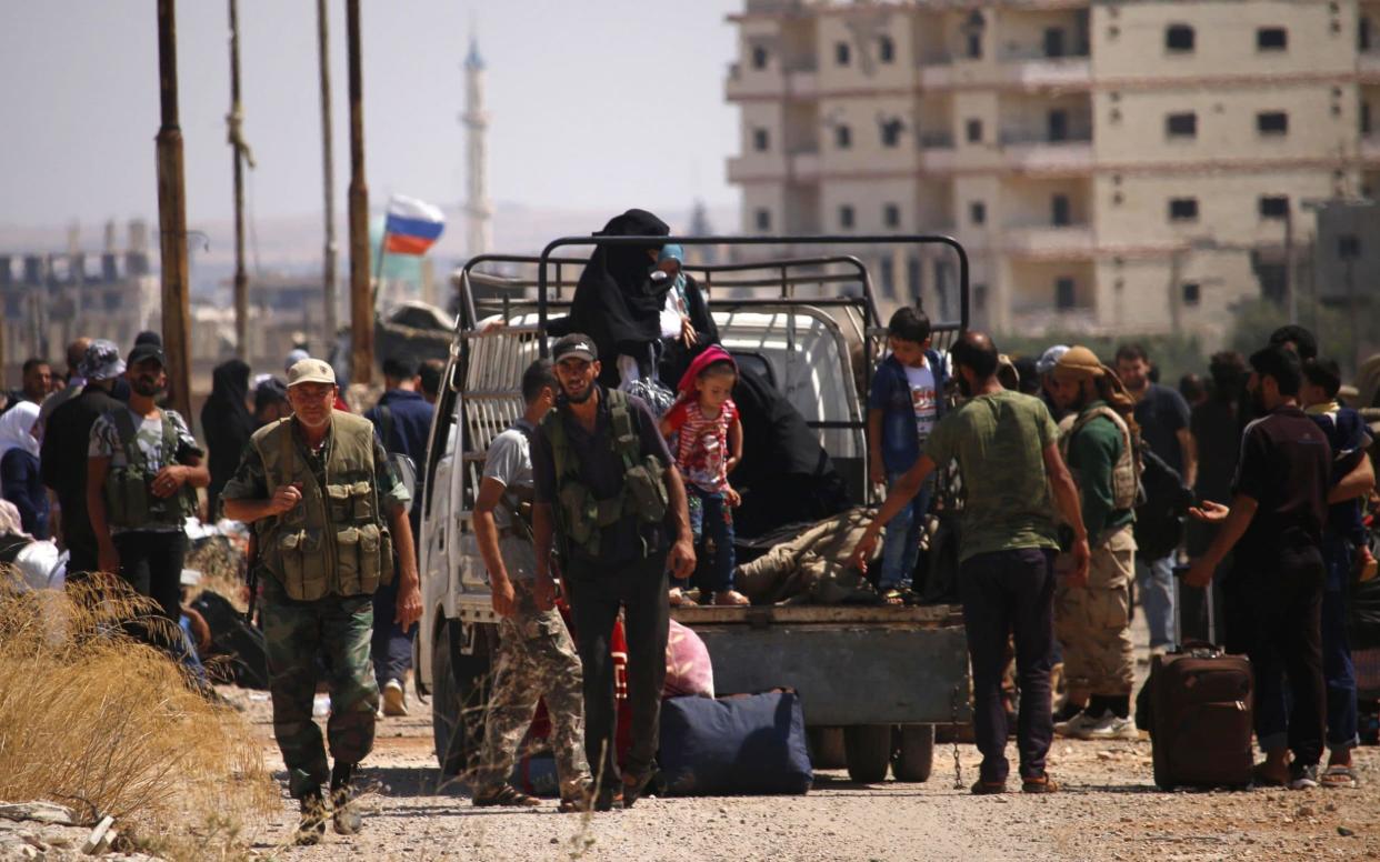 Syrian rebels and their relatives began evacuating Daraa marking a highly symbolic stage of the civil war - AFP