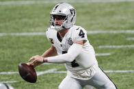 Las Vegas Raiders quarterback Derek Carr (4) works in the pocket against the Atlanta Falcons during the second half of an NFL football game, Sunday, Nov. 29, 2020, in Atlanta. (AP Photo/John Bazemore)