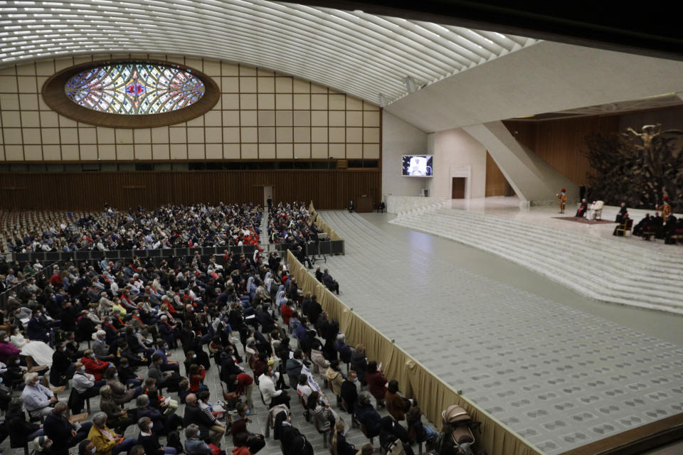 Faithful gather in the Paul VI hall during Pope Francis weekly general audience at the Vatican, Wednesday, Oct. 21, 2020. The Vatican is putting an end to Pope Francis’ general audiences with the public amid a surge in coronavirus cases in Italy and a confirmed infection at Oct. 21 encounter. The Vatican said Thursday that Francis would resume livestreaming his weekly catechism lessons from his library in the Apostolic Palace, as he did during the Vatican’s COVID-19 lockdown over the spring and summer. (AP Photo/Gregorio Borgia)