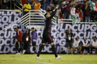 Mexico forward Rogelio Funes Mori (11) celebrates his second goal against Guatemala during the second half of a CONCACAF Gold Cup Group A soccer match in Dallas, Wednesday, July 14, 2021. (AP Photo/Michael Ainsworth)