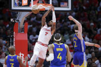 Houston Rockets forward Cam Whitmore (7) dunks over Golden State Warriors' Chris Paul (3), Moses Moody (4) and Brandin Podziemski (2) during the second half of an NBA basketball game Thursday, April 4, 2024, in Houston. (AP Photo/Michael Wyke)