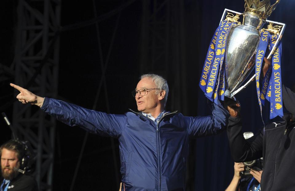FILE - In this Monday, May 16, 2016 file photo, Leicester's manager Claudio Ranieri shows the Premier League Trophy to fans at Victoria Park during the victory parade to celebrate winning the English Premier league title in Leicester, England. Leicester City announced Thursday, Feb. 23, 2017 that they have sacked manager Claudio Ranieri less than a year after their incredible run to the Premier League title. (AP Photo/Rui Vieira, File)