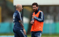 FILE PHOTO: Football Soccer - Argentina's national soccer team training - World Cup 2018 Qualifiers - Buenos Aires, Argentina - August 28, 2017 - Argentina's head coach Jorge Sampaoli talks to Lionel Messi during a training session ahead of the match against Uruguay. REUTERS/Marcos Brindicci/File Photo