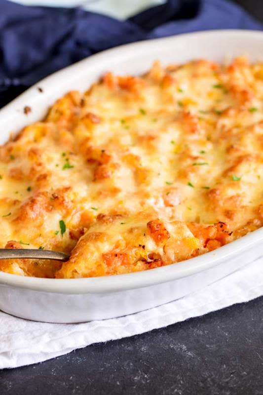 <p>Sprinkles and Sprouts</p><p>This easy cheesy rutabaga and carrot casserole makes the perfect make ahead side dish.</p><p><strong>Get the recipe: <a href="https://www.sprinklesandsprouts.com/cheesy-rutabaga-carrot-casserole/" rel="nofollow noopener" target="_blank" data-ylk="slk:Cheesy Rutabaga Carrot Casserole;elm:context_link;itc:0;sec:content-canvas" class="link rapid-noclick-resp"><em>Cheesy Rutabaga Carrot Casserole</em></a></strong></p>