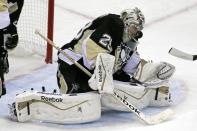 Pittsburgh Penguins goalie Marc-Andre Fleury stops a shot in the third period of a first-round NHL playoff hockey game against the Columbus Blue Jackets in Pittsburgh on Wednesday, April 16, 2014. The Penguins won 4-3. (AP Photo/Gene J. Puskar)