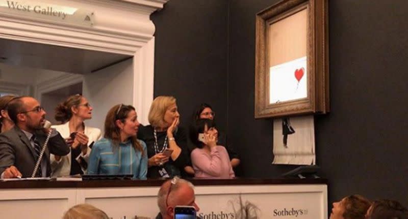 There was a sea of stunned faces as the shredder took control. Source: Banksy/ Instagram