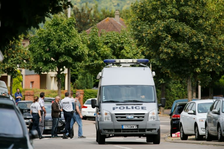French policemen on July 26, 2016 in the Normandy city of Saint-Etienne du Rouvray after a priest was killed