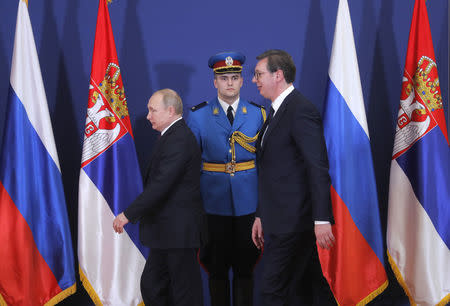 Russian President Vladimir Putin and Serbian President Aleksandar Vucic arrive for a ceremony to sign bilateral documents during their meeting in Belgrade, Serbia January 17, 2019. Maxim Shipenkov/Pool via REUTERS