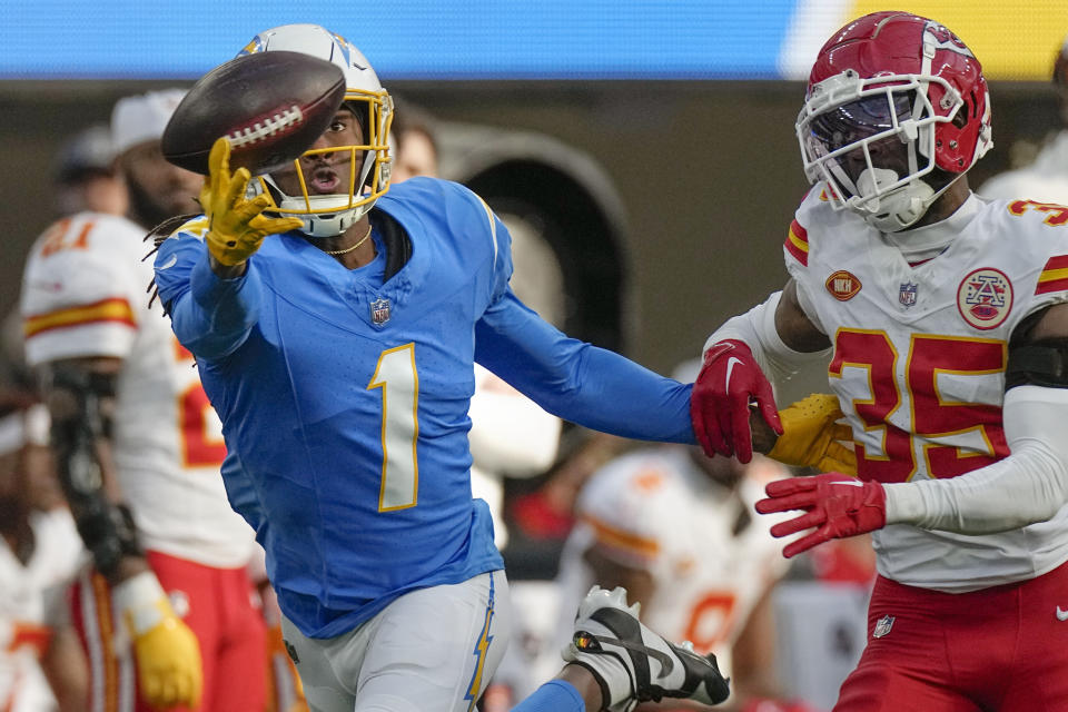 Los Angeles Chargers wide receiver Quentin Johnston (1) can't make the catch as Kansas City Chiefs cornerback Jaylen Watson, right, looks on during the first half of an NFL football game, Sunday, Jan. 7, 2024, in Inglewood, Calif. Watson was called for pass interference on the play. (AP Photo/Mark J. Terrill)