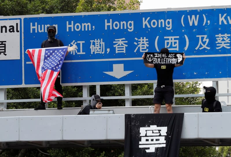 Anti-government demonstrators attend a protest march in Hong Kong