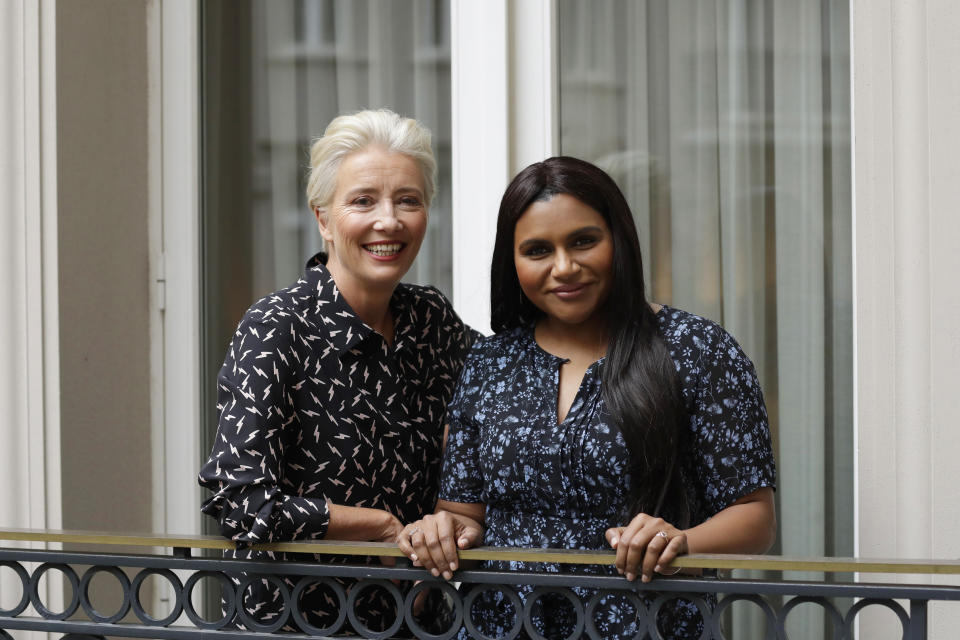 This May 17, 2019 photo shows British actress Emma Thompson and U.S. actress and screenwriter Mindy Kaling posing on a hotel balcony in London to promote their film, "Late Night." (AP Photo/Matt Dunham)