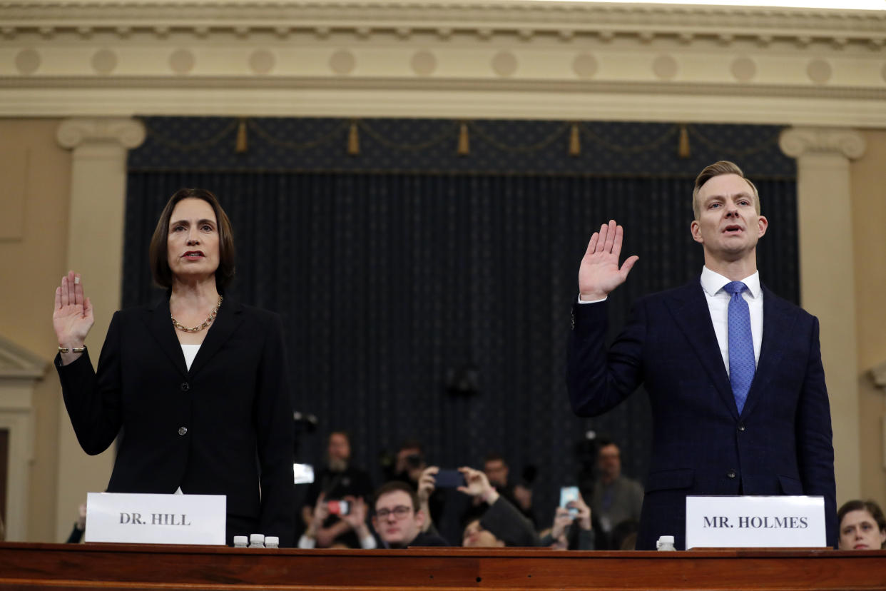 Former White House national security aide Fiona Hill, left, and David Holmes, a U.S. diplomat in Ukraine, are sworn in to testify before the House Intelligence Committee on Capitol Hill in Washington, Thursday, Nov. 21, 2019, during a public impeachment hearing of President Donald Trump's efforts to tie U.S. aid for Ukraine to investigations of his political opponents. (Photo: Andrew Harnik/AP)