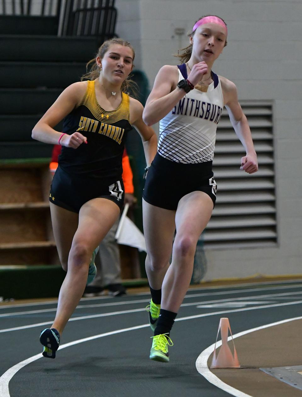 Smithsburg's Grace Ellis leads South Carroll's Lauren Chesney on her way to victory in the girls 500 at the Maryland Class 1A West Indoor Track & Field Championships at Hagerstown Community College.