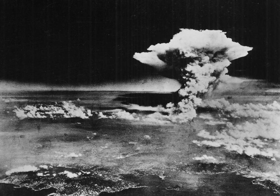 This handout picture released by the U.S. Army shows the plume of smoke from a mushroom cloud billow about one hour after the nuclear bomb was detonated above Hiroshima, Japan, on Aug. 6, 1945. Two planes participated in this mission; the Enola Gay carried and dropped the weapon, and another was an escort.
