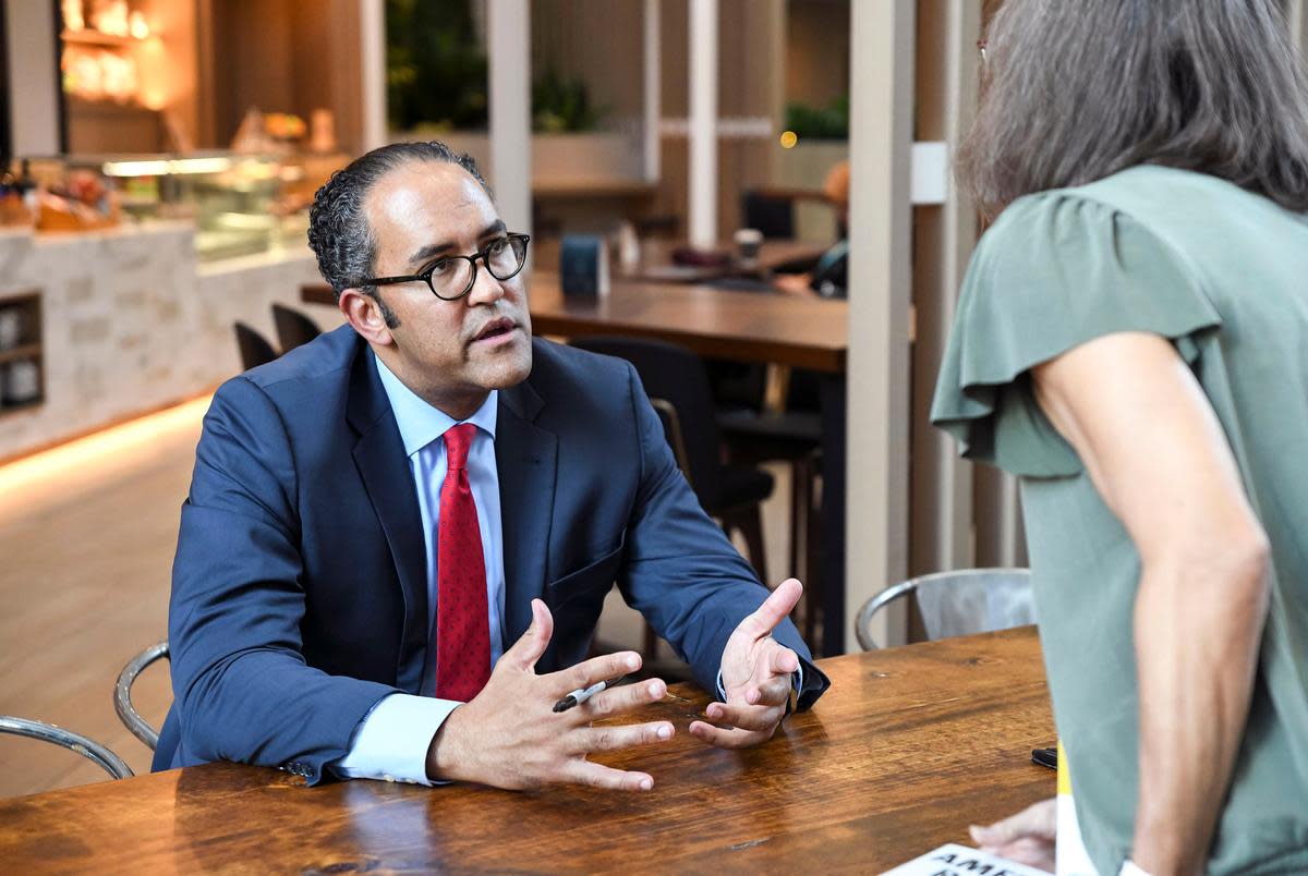 Will Hurd signs copies of his book “American Reboot” at The Texas Tribune Festival in Austin on Sept. 22, 2022.