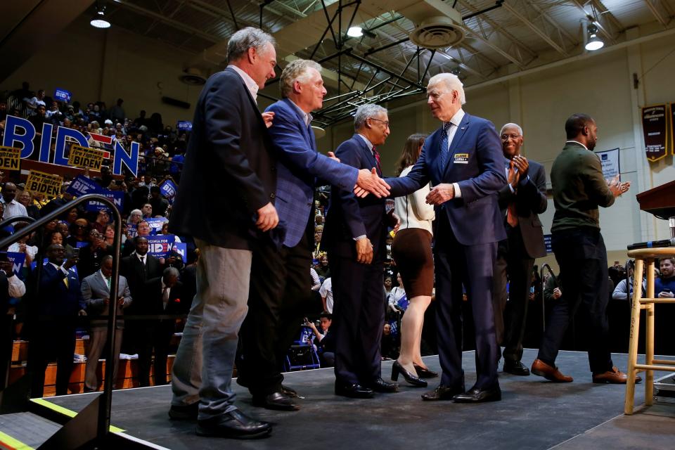 Democratic U.S. presidential candidate and former U.S. Vice President Joe Biden shakes hands with former Virginia Governor Terry McAuliffe at the end of a campaign event at Booker T. Washington High School in Norfolk, Virginia, U.S., March 1, 2020.  REUTERS/Elizabeth Frantz