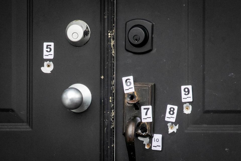 Bullet holes are pictured at a home near 2800-block of154th street in Surrey, British Columbia on Thursday, February 1, 2024. 