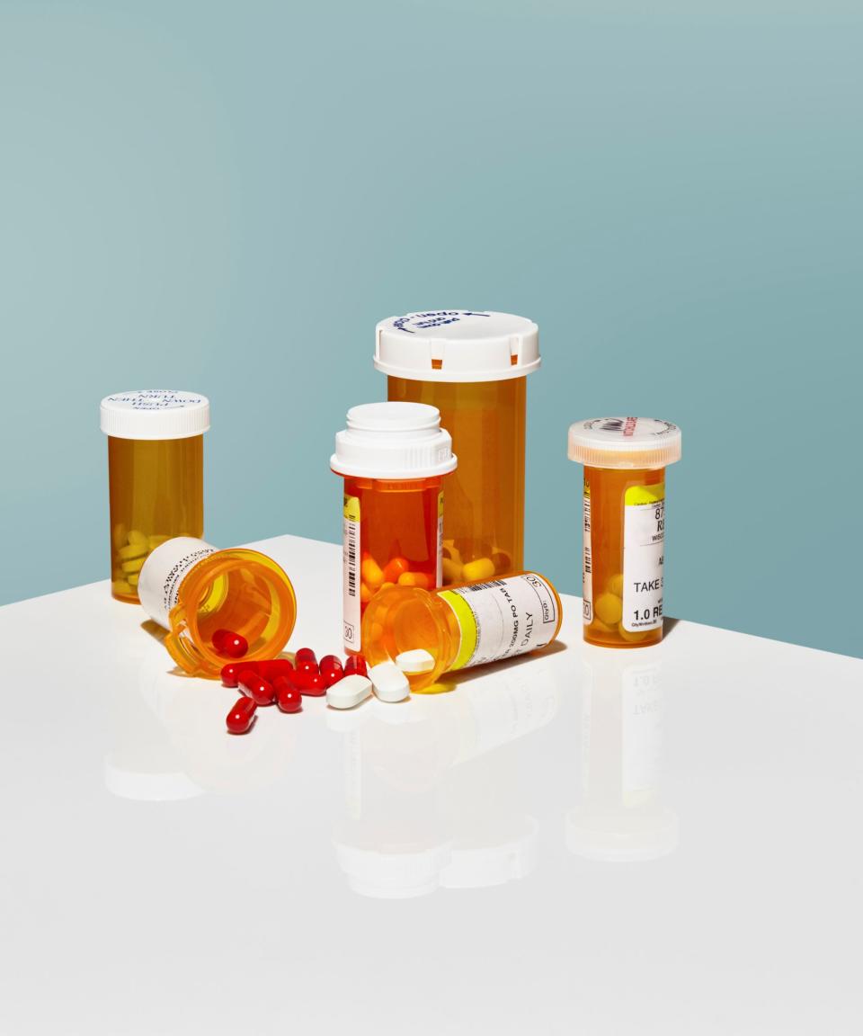 A collection of orange medicine bottles