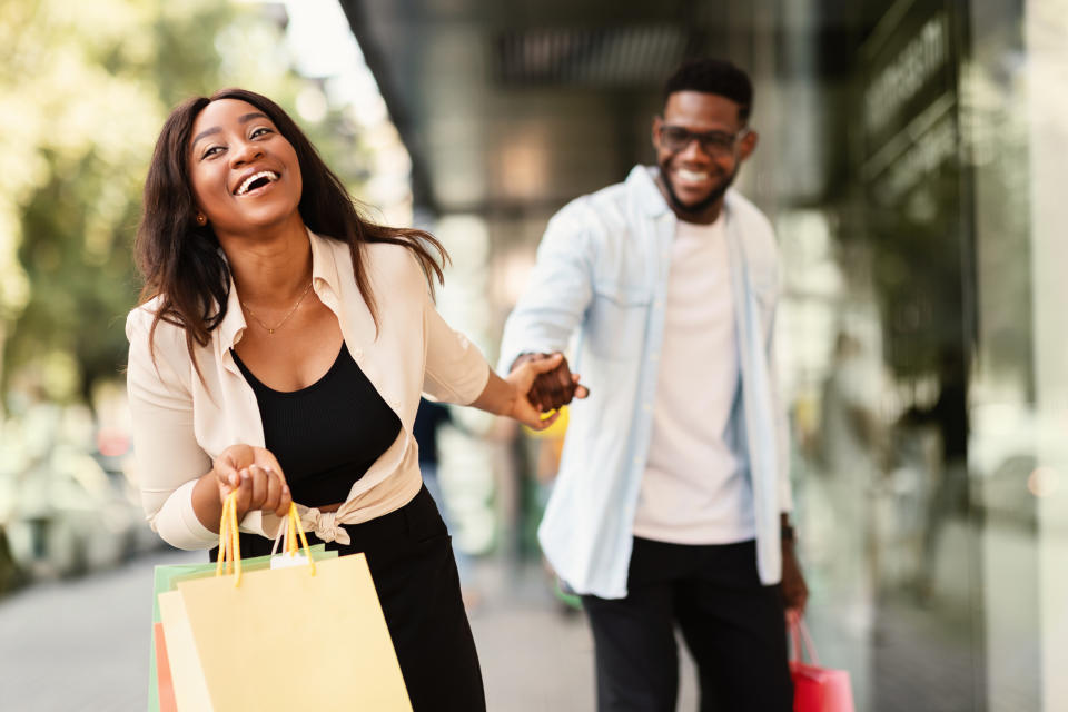 A couple out shopping and smiling