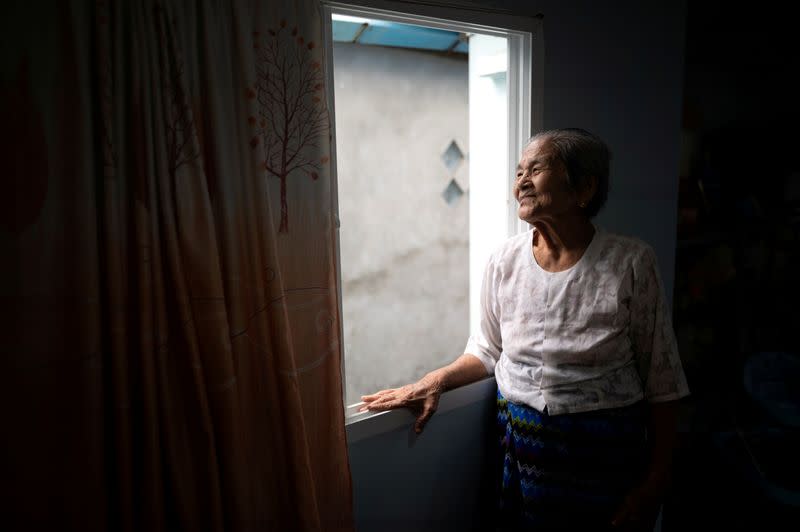 Daw Thein Khin, a 100-year-old woman survivor of the coronavirus disease (COVID-19), poses for a photo at her home in Yangon