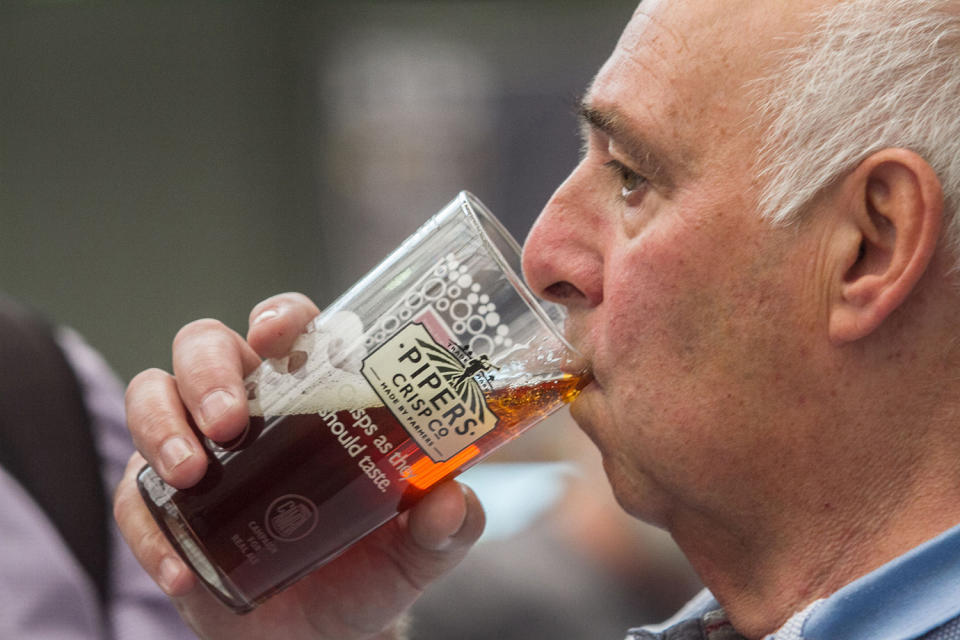 <p>A visitor enjoys a pint at the Great British Beer Festival, August 8, 2017 in London, England. (Photo: Amer Ghazzal/REX/Shutterstock) </p>