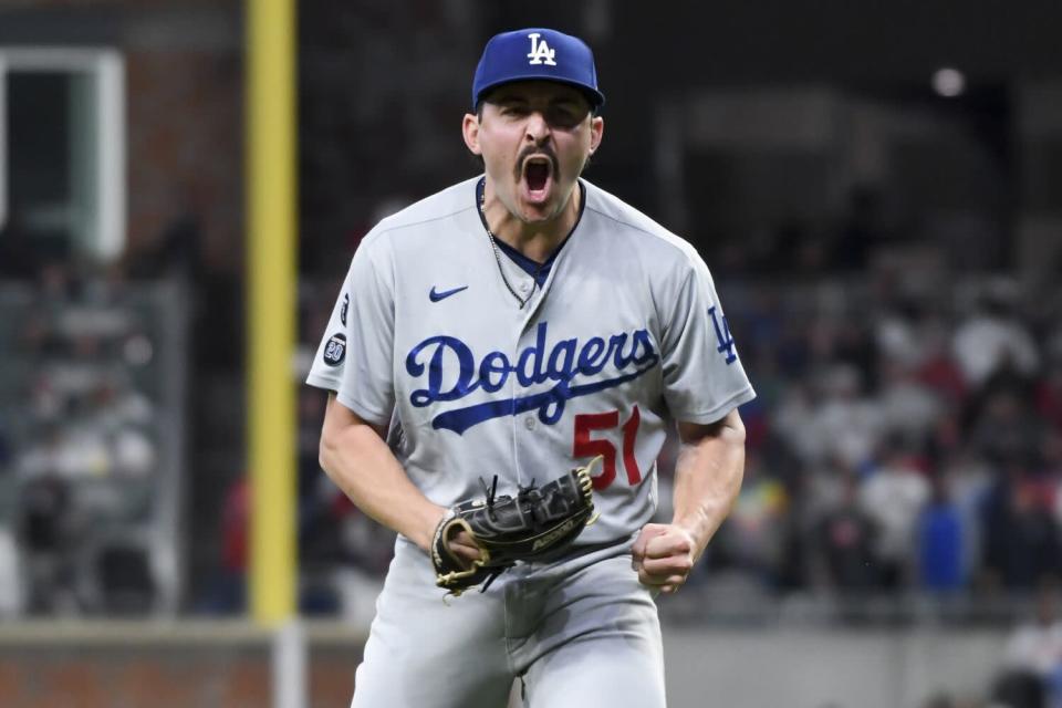 Dodgers reliever Alex Vesia lets out a yell after retiring the side during a playoff game last season.