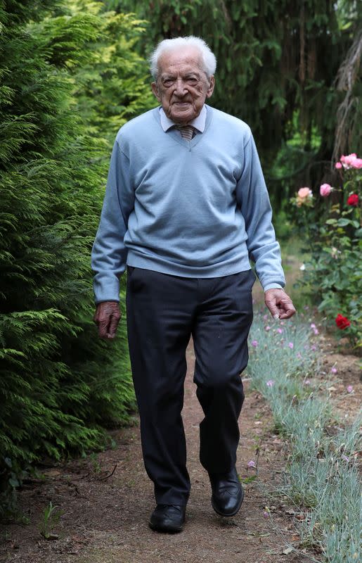 Alfons Leempoels walks the equivalent of a marathon in his garden to raise money to fight against the coronavirus disease (COVID-19) in Rotselaar