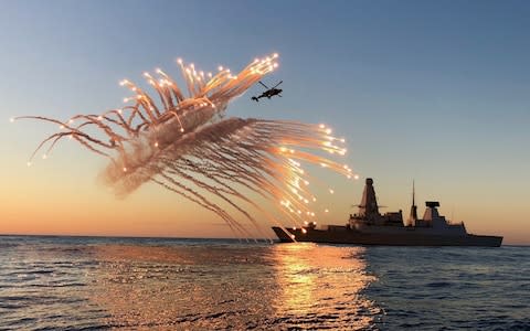 HMS Diamond, a Type 45 destroyer, on operations in the Mediterranean sea in 2018 with her Wildcat helicopter test firing it's defensive aid suite. - Credit: Lt Cdr Oliver Clark/Royal Navy