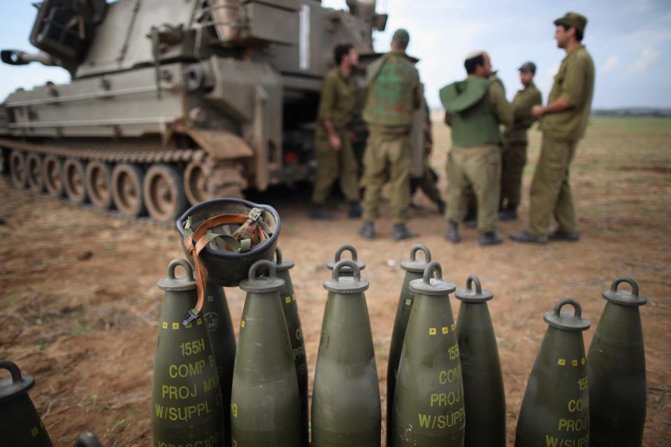 UNSPECIFIED, ISRAEL - NOVEMBER 19: Israeli soldiers prepare an artillery emplacement overlooking Gaza on November 19, 2012 on Israel's border with the Gaza Strip. The death toll has risen to at least 85 killed in the air strikes, according to hospital officials, on day six since the launch of operation 'Pillar of Defence.' (Photo by Christopher Furlong/Getty Images)