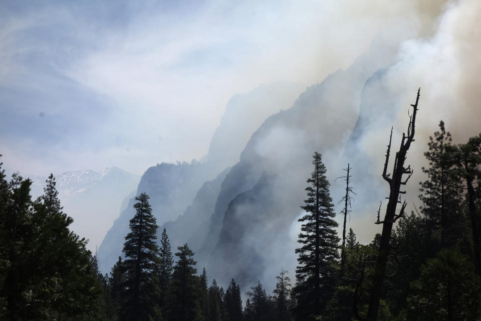 In this June 11, 2019 photo, canyon walls are shrouded with smoke from a prescribed burn in Kings Canyon National Park, Calif. The prescribed burn, a low-intensity, closely managed fire, was intended to clear out undergrowth and protect the heart of Kings Canyon National Park from a future threatening wildfire. The tactic is considered one of the best ways to prevent the kind of catastrophic destruction that has become common, but its use falls woefully short of goals in the West. (AP Photo/Brian Melley)