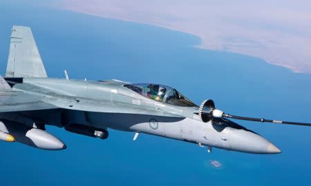 A supplied image of a Royal Australian Air Force F/A-18A Hornet refuelling from a KC-30A Multi Role Tanker Transport in the skies over the Middle East region April 22, 2016. Australian Defence Force/Handout via REUTERS