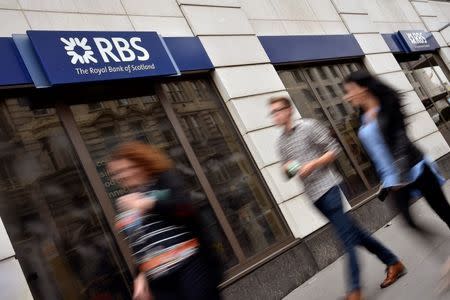 People walk past a branch of The Royal Bank of Scotland (RBS) in central London August 27, 2014. REUTERS/Toby Melville