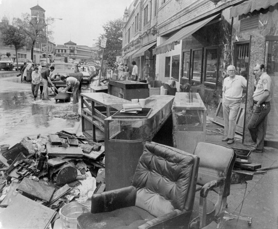 Merchants along Nichols Road assess the damage of the 1977 Plaza Flood. The Kansas City Star.