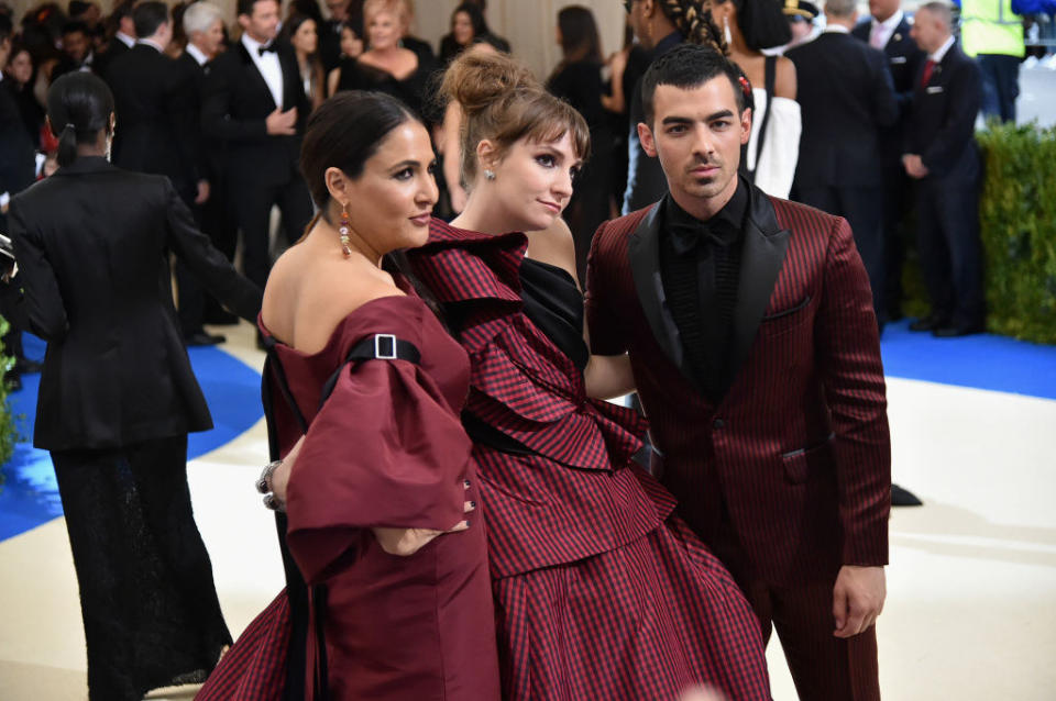 Jenni Konner, Lena Dunham, and Joe Jonas at the Met Gala.