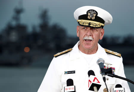 FILE PHOTO - Admiral Scott Swift, Commander of the U.S. Pacific Fleet, speaks at a news conference near the damaged USS John McCain and the USS America at Changi Naval Base in Singapore August 22, 2017. REUTERS/Calvin Wong/File Photo